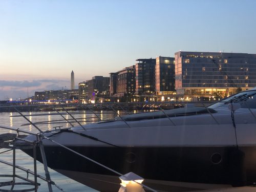 Monument at night with yacht at Gangplank